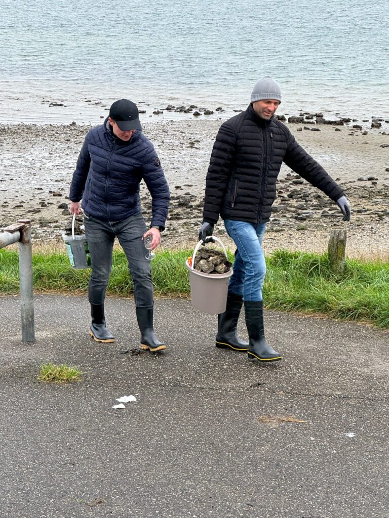 Jodi M Noord two men with buckets